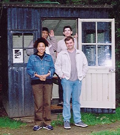 The cast pose outside the Summer House